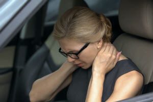 grabbing back of neck from accident