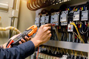 worker handling electrical wires