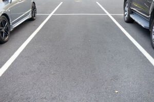 parking space between two cars