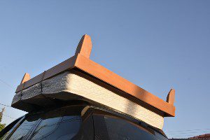 car transporting mattress on roof