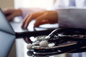 doctor reviewing crash victims injuries