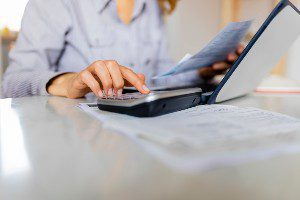 woman calculating income limit for disability