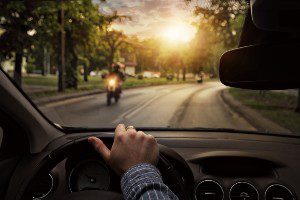 driver passing motorcyclist 