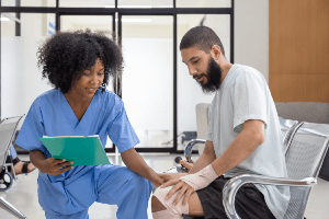 nurse attending an injured patient