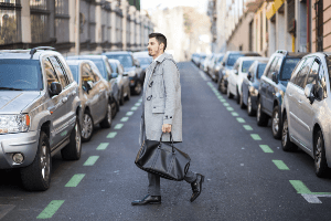 man improperly crossing the road