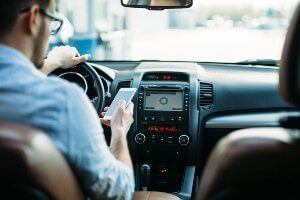 driver using phone for texting