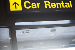 yellow car rental sign