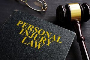 personal injury law book with gavel