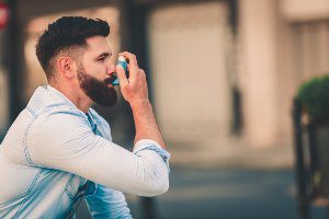 man with inhaler