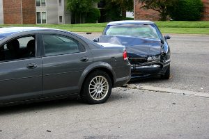 Rear end car crash in a residential neighborhood.