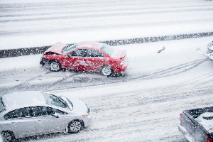 multi-vehicle car accident on snow-covered roads